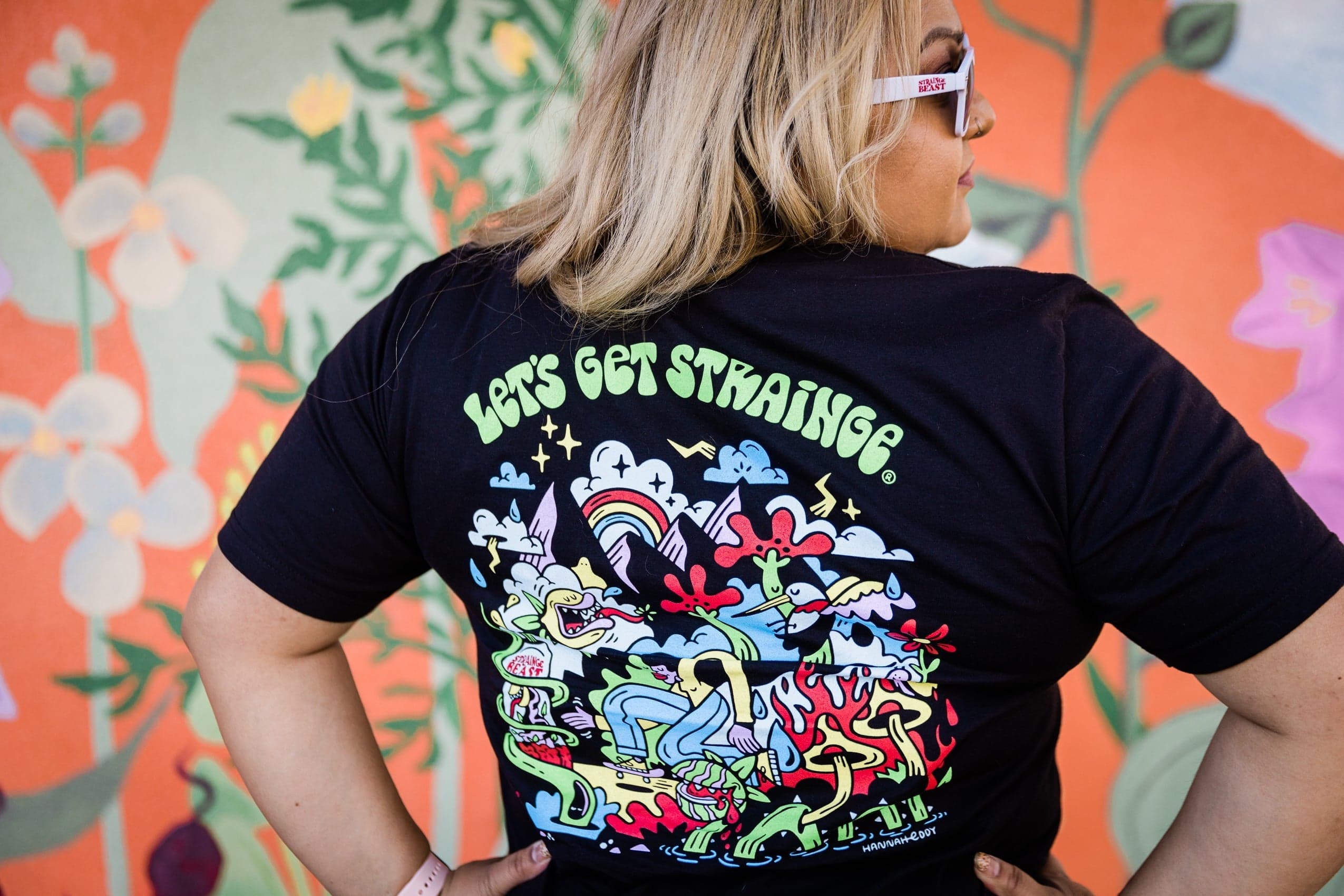 Sierra Nevada Brewing Co. Strainge Beast X Hannah Eddy T-Shirt worn by a woman displaying the back graphic