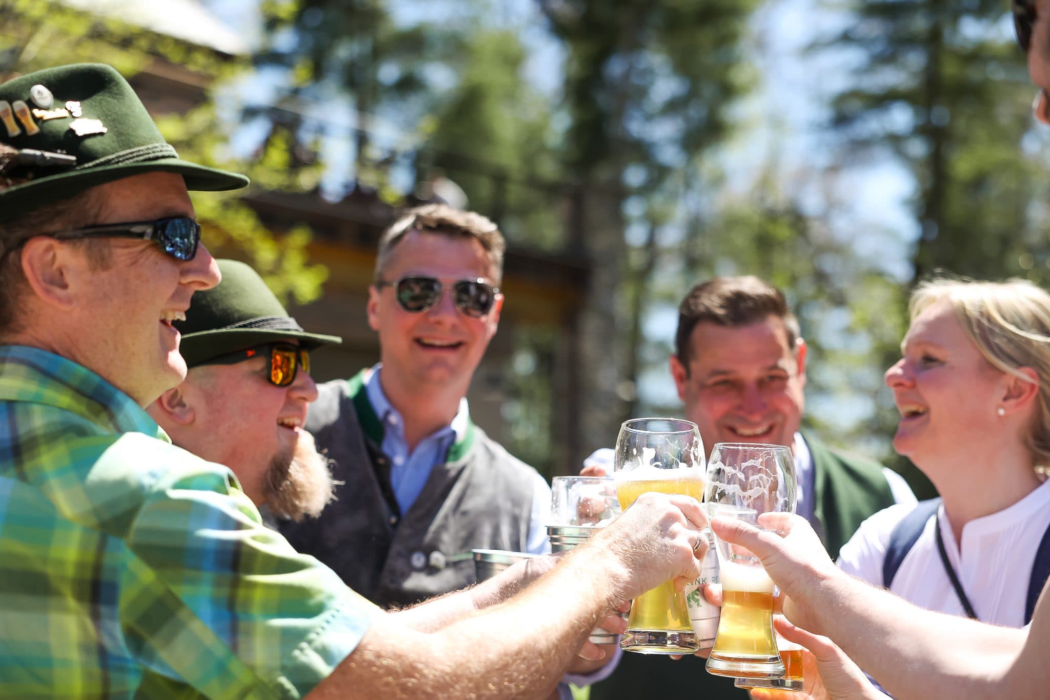 Oktoberfest beer being cheersed by crowd outside