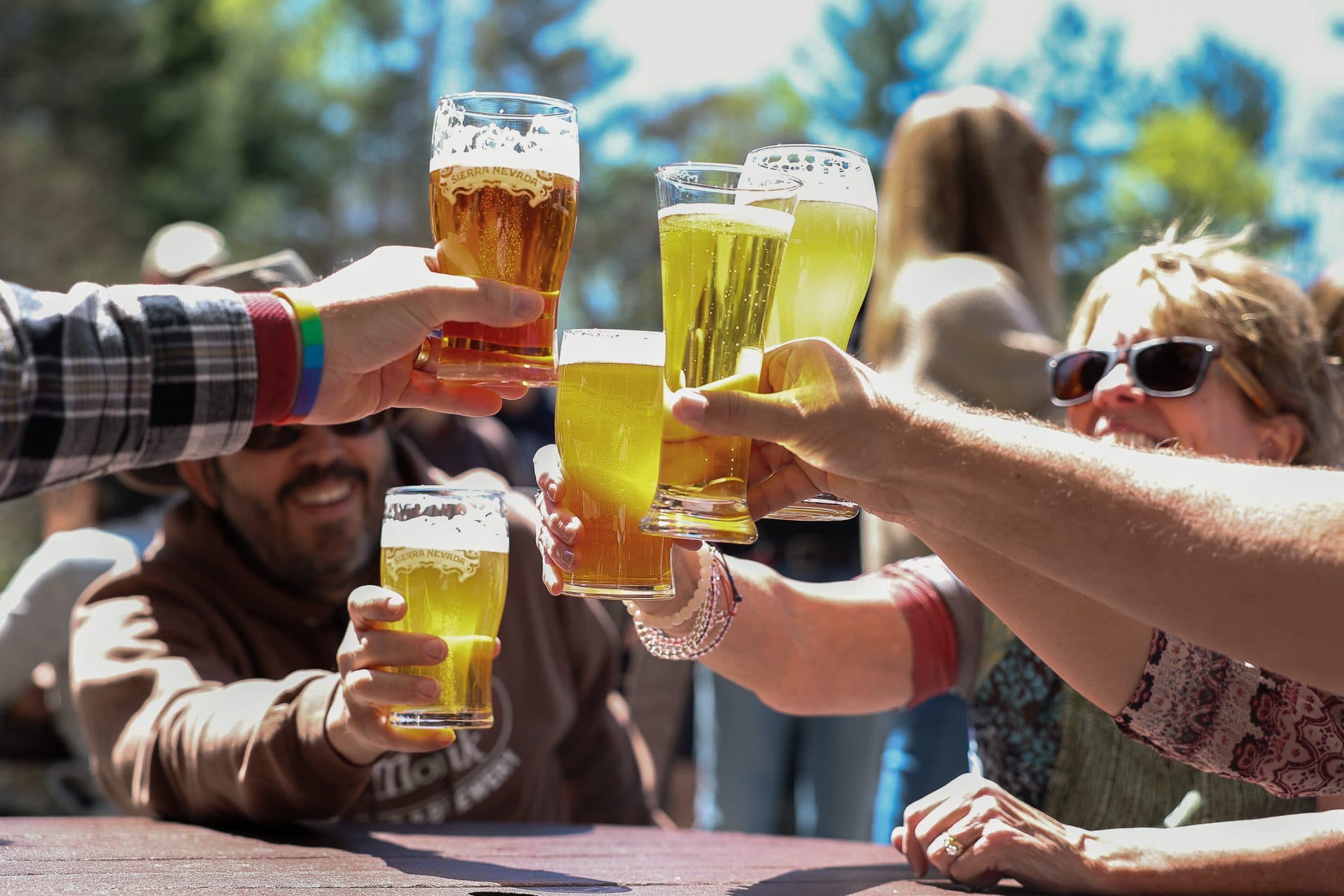 Oktoberfest beer being cheersed by crowd outside