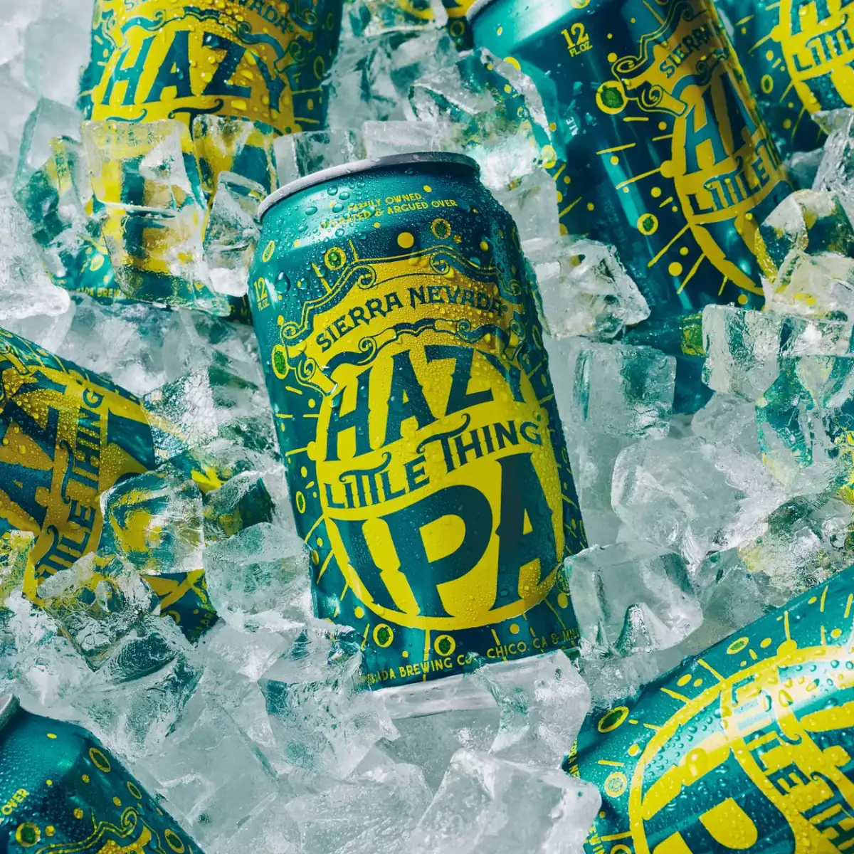 Cans of Hazy Little Thing laying in bed of ice cubes